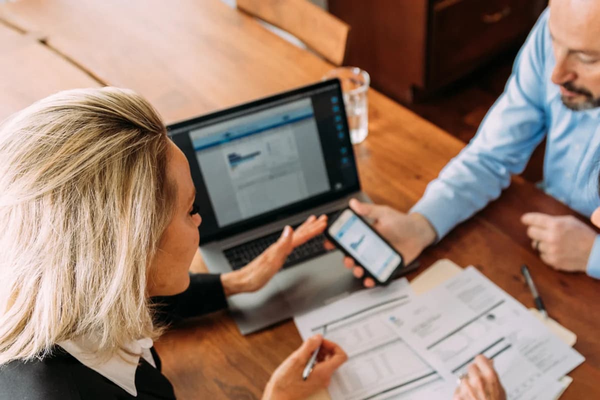 Presidential Bank Mortgage loan officer discussing refinancing options with clients